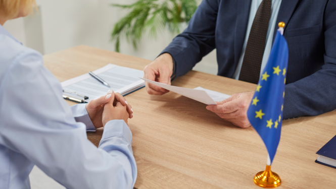 Passport check at European border illustrating the transition from manual stamps to the EU Entry/Exit System (EES) in 2025